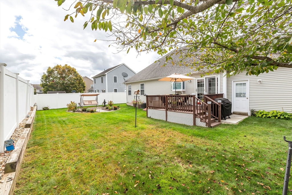 297 Christopher Drive Springfield, MA 01119 - Photo 5 of 30 a view of a house with a yard porch and sitting area