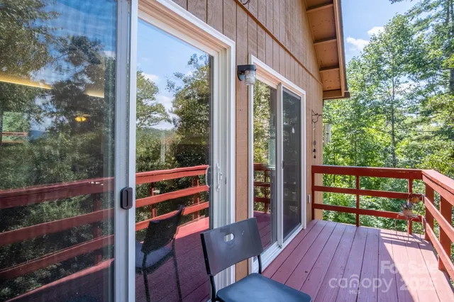 a view of a balcony with chairs