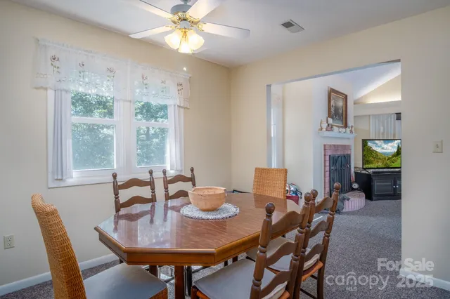 a view of a dining room with furniture window and outside view