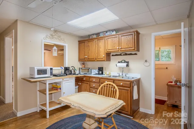a kitchen with a stove a sink and a refrigerator