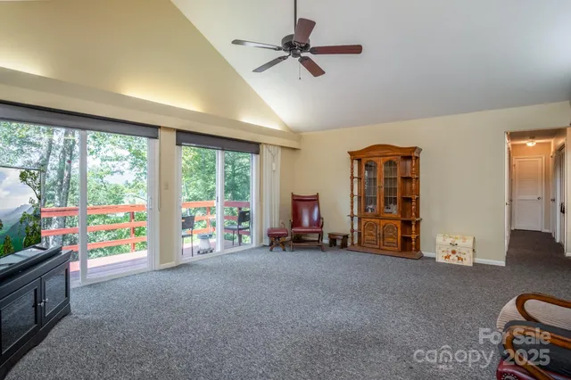 a view of a room with toys and a large window