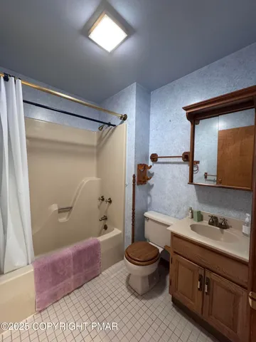 a bedroom with bed and a window