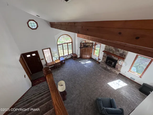 a living room with furniture and a rug