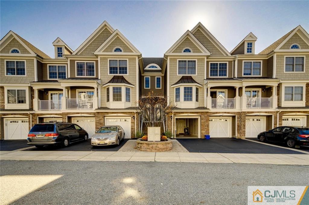59 Raritan Reach Road, Unit 30 South Amboy, NJ 08879 - Photo 1 of 25 a front view of multiple houses
