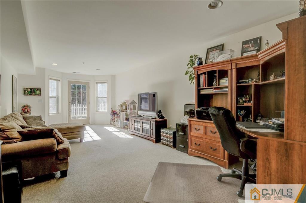59 Raritan Reach Road, Unit 30 South Amboy, NJ 08879 - Photo 15 of 25 a bedroom with furniture and a book shelf