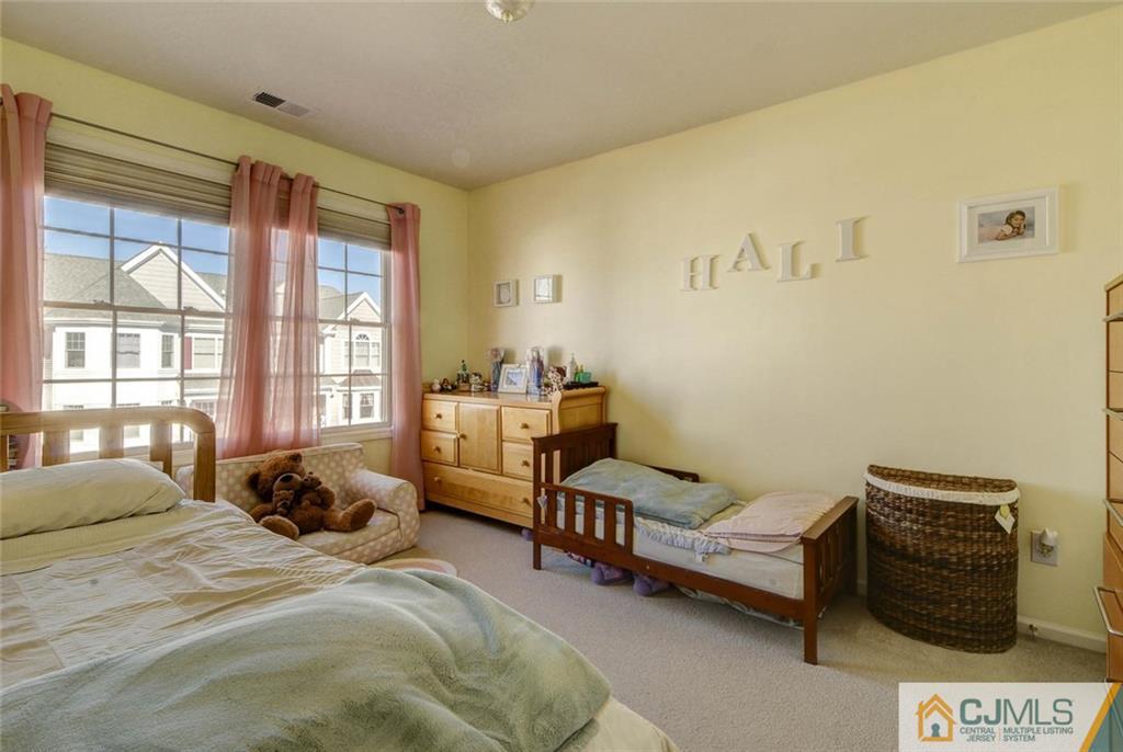 59 Raritan Reach Road, Unit 30 South Amboy, NJ 08879 - Photo 19 of 25 a bedroom with a bed and a window