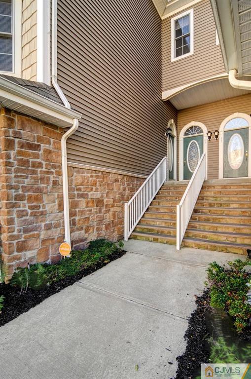 59 Raritan Reach Road, Unit 30 South Amboy, NJ 08879 - Photo 3 of 25 a view of a pathway of a house