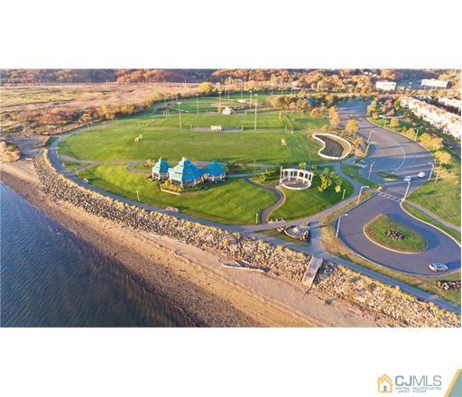 59 Raritan Reach Road, Unit 30 South Amboy, NJ 08879 - Photo 24 of 25 a view of a city from a lake