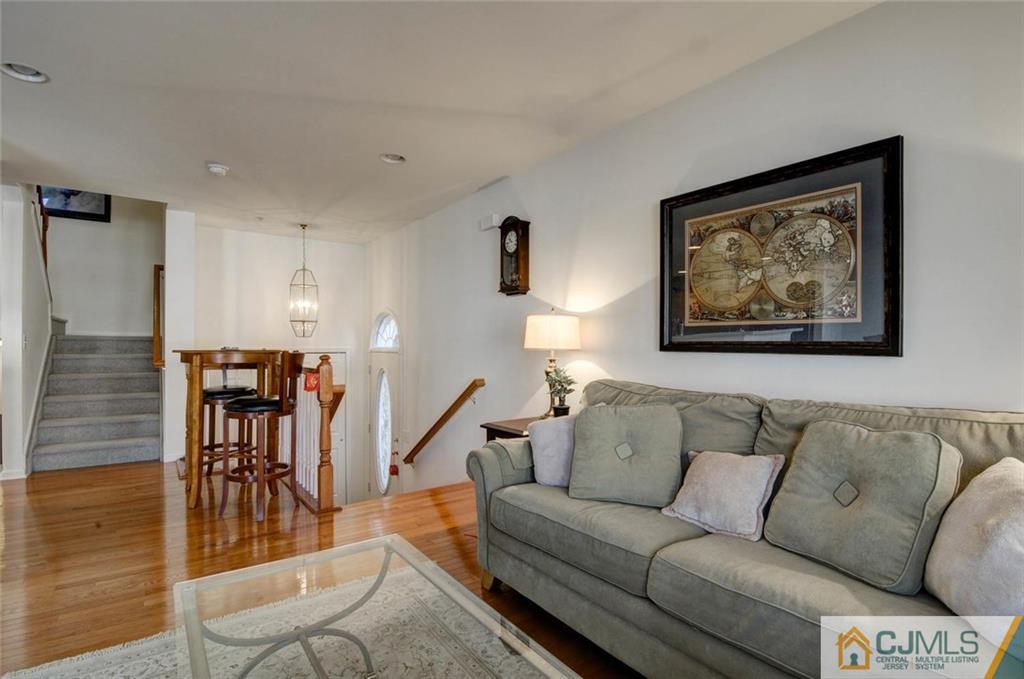 59 Raritan Reach Road, Unit 30 South Amboy, NJ 08879 - Photo 5 of 25 a living room with furniture and kitchen view