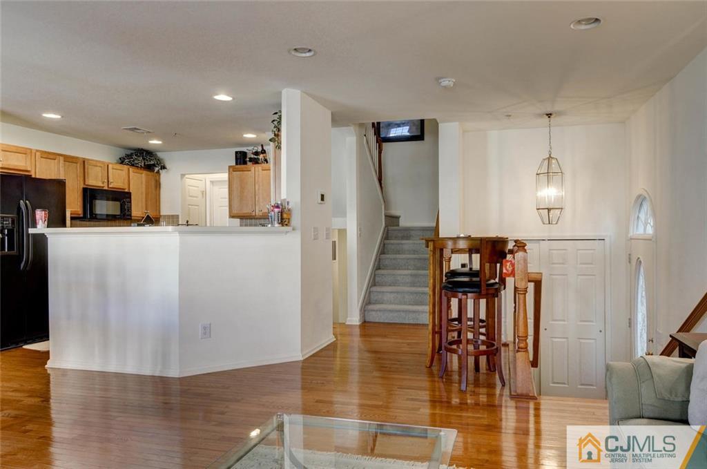59 Raritan Reach Road, Unit 30 South Amboy, NJ 08879 - Photo 7 of 25 a view of a living room and kitchen view
