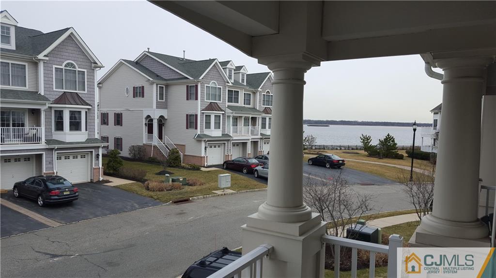 59 Raritan Reach Road, Unit 30 South Amboy, NJ 08879 - Photo 9 of 25 a view of a building with many windows
