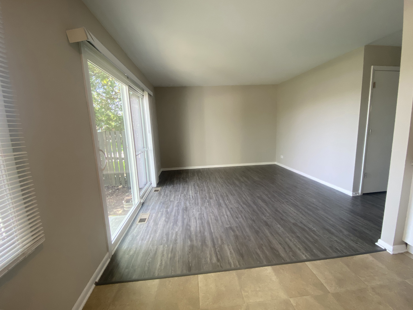 1920 Georgetown Lane Hoffman Estates, IL 60169 - Photo 14 of 28 an empty room with wooden floor and windows