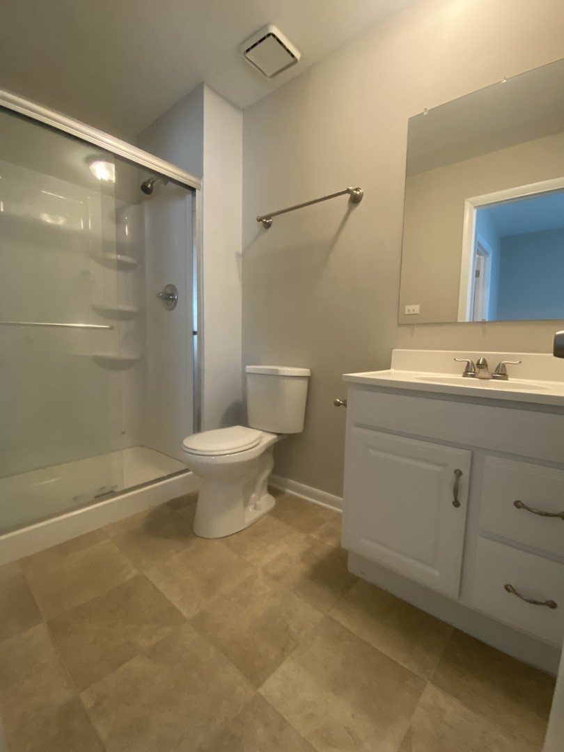 1920 Georgetown Lane Hoffman Estates, IL 60169 - Photo 28 of 28 a bathroom with a sink toilet and shower