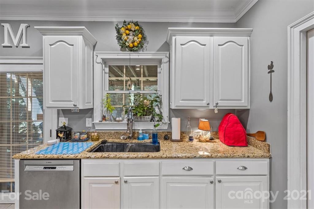517 Mason Dickson Road York, SC 29745 - Photo 22 of 48 a kitchen with stainless steel appliances granite countertop a sink and cabinets