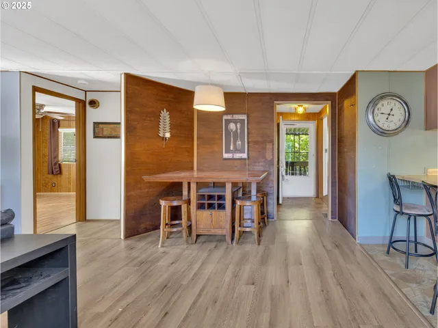 a view of a livingroom with furniture window and wooden floor