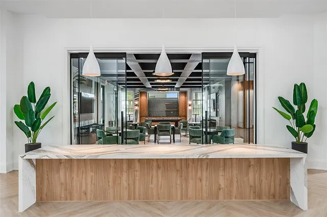 a outdoor space with patio the couches and pool table and chairs under an umbrella