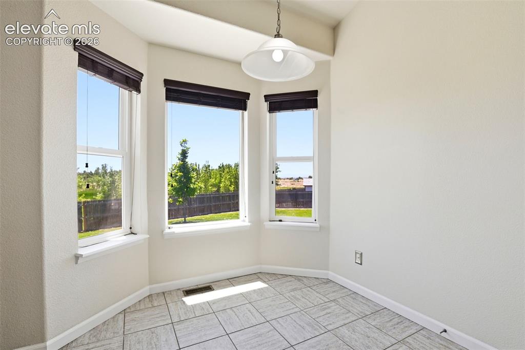 7806 Dutch Loop Colorado Springs, CO 80925 - Photo 12 of 41 a view of an empty room with a window