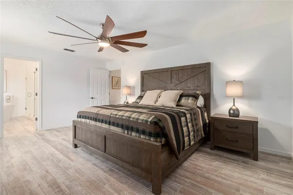 a bedroom with a bed and closet