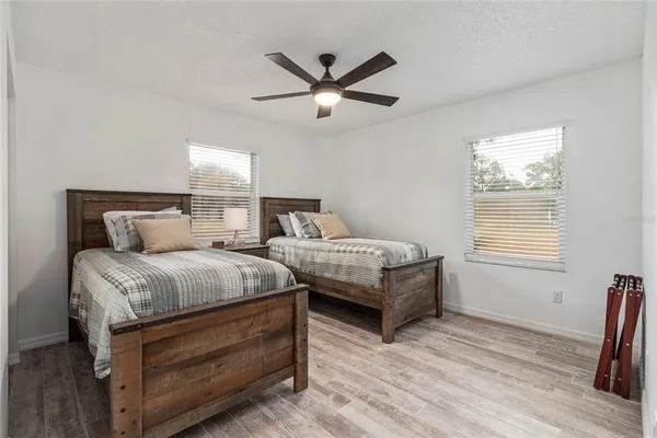 a bedroom with bed and window