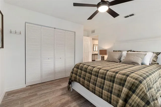 a bedroom with bed and window