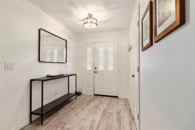 a view of a hallway with front door