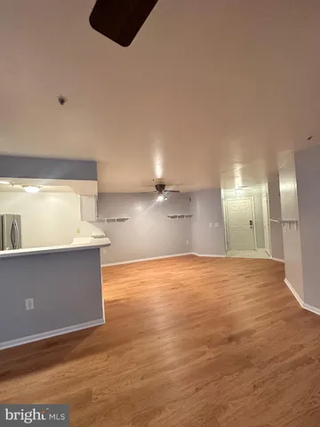 an empty room with wooden floor