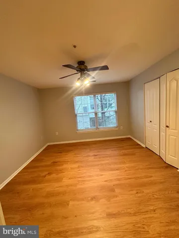 an empty room with a empty space and windows