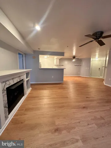 a view of a kitchen with a stove cabinets and a wooden floor
