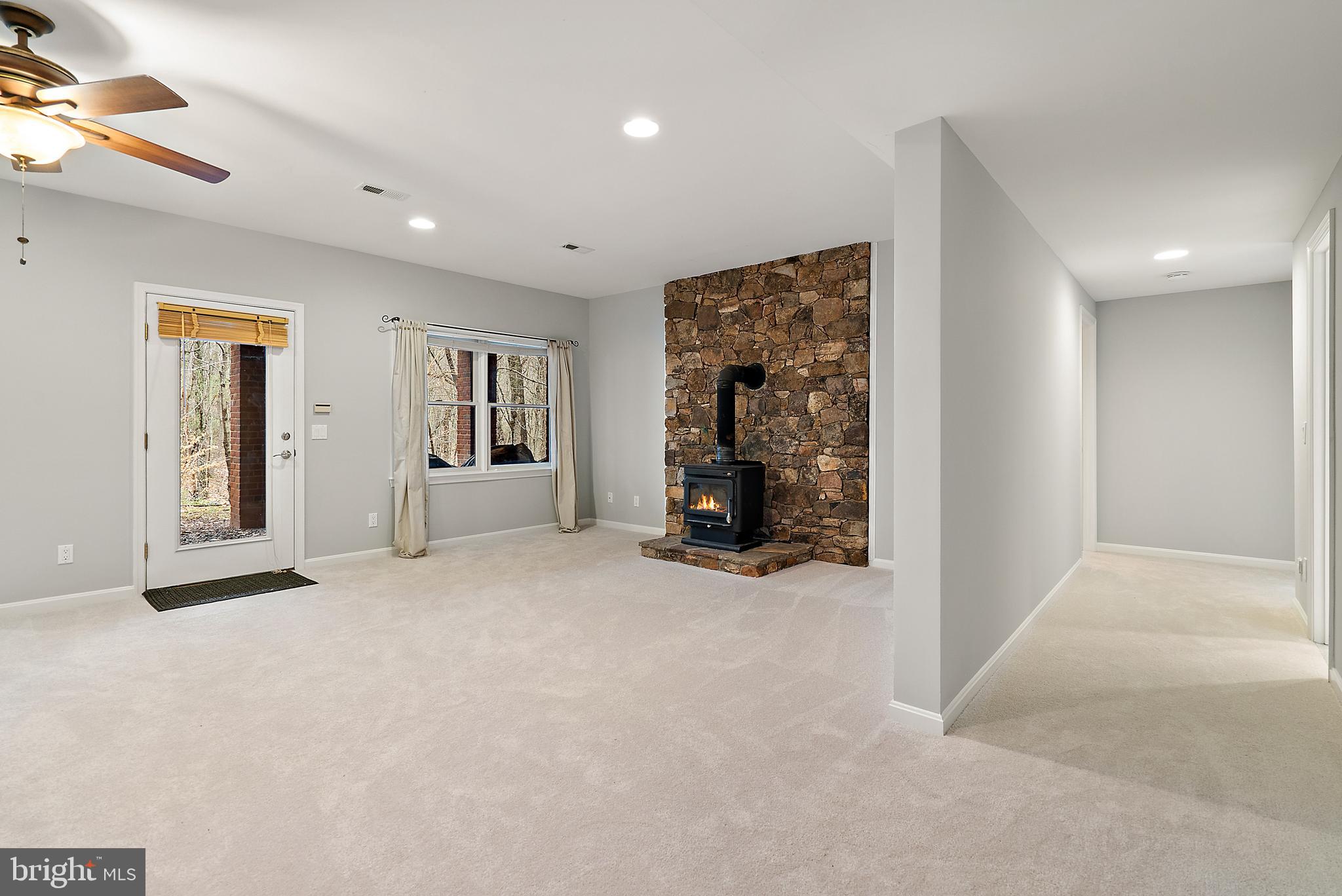 6276 Beverleys Mill Road Broad Run, VA 20137 - Photo 24 of 41 Walk out in the basement with wood stove.