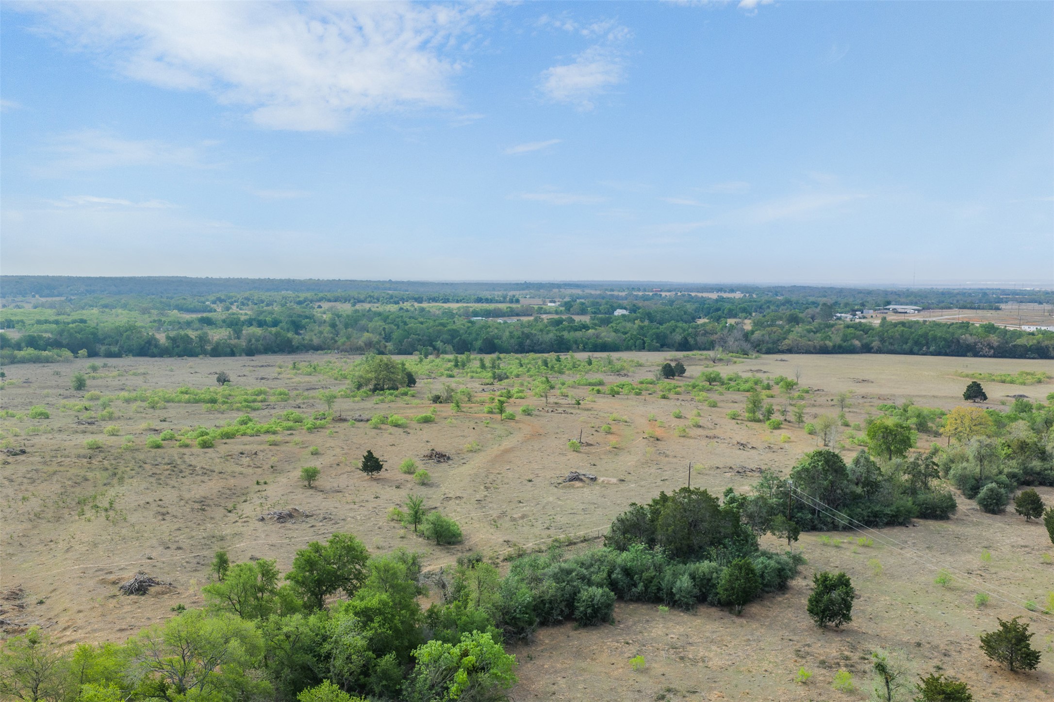 579 Lower Elgin Road Elgin, TX 78621 - Photo 30 of 40 a view of a lake with a city view