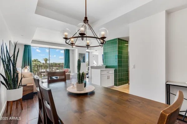 a view of a dining room with furniture window and outside view