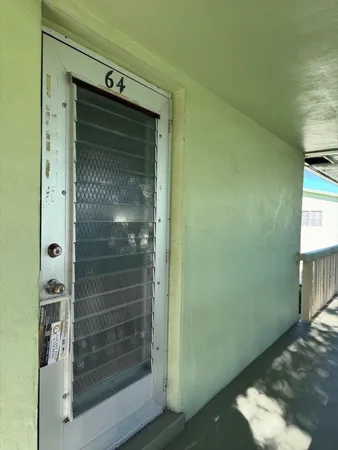 a bathroom with a glass door shower