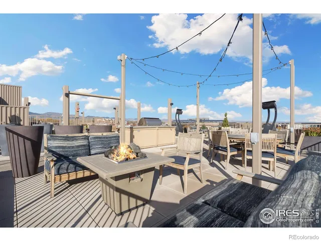 a view of a dining hall with furniture and wooden floor