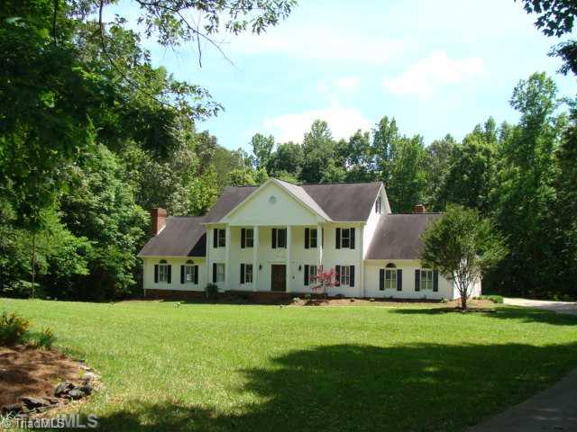 6865 High Rock Road Browns Summit, NC 27214 - Photo 1 of 16 Exterior Front. Custom Built home on 21 Acres! Huge pool! Over 4400 sqft of heated living space! Extensive moldings through out! Garage inlcudes large 25x8 storage/work shop! Must see!