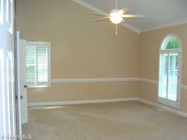 6865 High Rock Road Browns Summit, NC 27214 - Photo 11 of 16 Master Bedroom. Huge master suite with vaulted ceilings, his/her closets, one being large walk in, arched windows, lots of natural light and very very spacious!