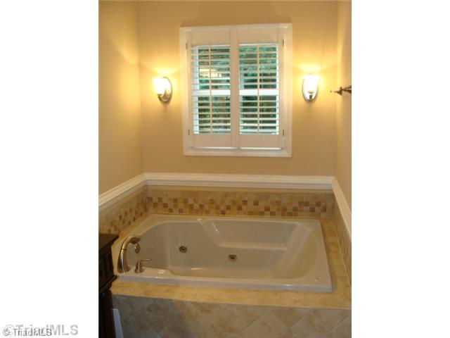 6865 High Rock Road Browns Summit, NC 27214 - Photo 13 of 16 Master Bath/Spa. New tile work surrounding this large jetted tub! Nice setting