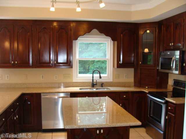 6865 High Rock Road Browns Summit, NC 27214 - Photo 6 of 16 Kitchen. Kitchen also includes large pantry, island and bar area!