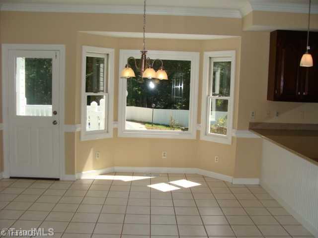 6865 High Rock Road Browns Summit, NC 27214 - Photo 7 of 16 Breakfast. Large eat in breakfast area! Tiled flooring and great view of back yard and pool area!
