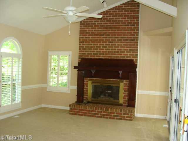 6865 High Rock Road Browns Summit, NC 27214 - Photo 10 of 16 Den/Family/Great Room. Large den/family room with vaulted ceilings & nice fireplace! Custom built in plantation shutters! This room is also includes a wall of glass sliding doors leading into the sun room!