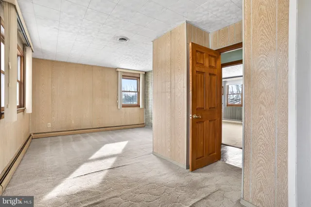 a view of an empty room and window