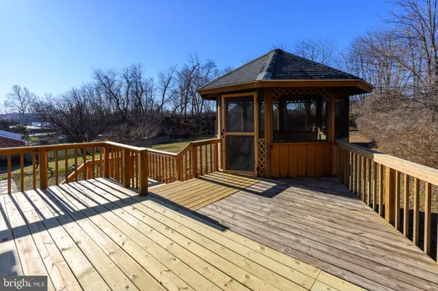 a view of wooden deck with a table and chairs