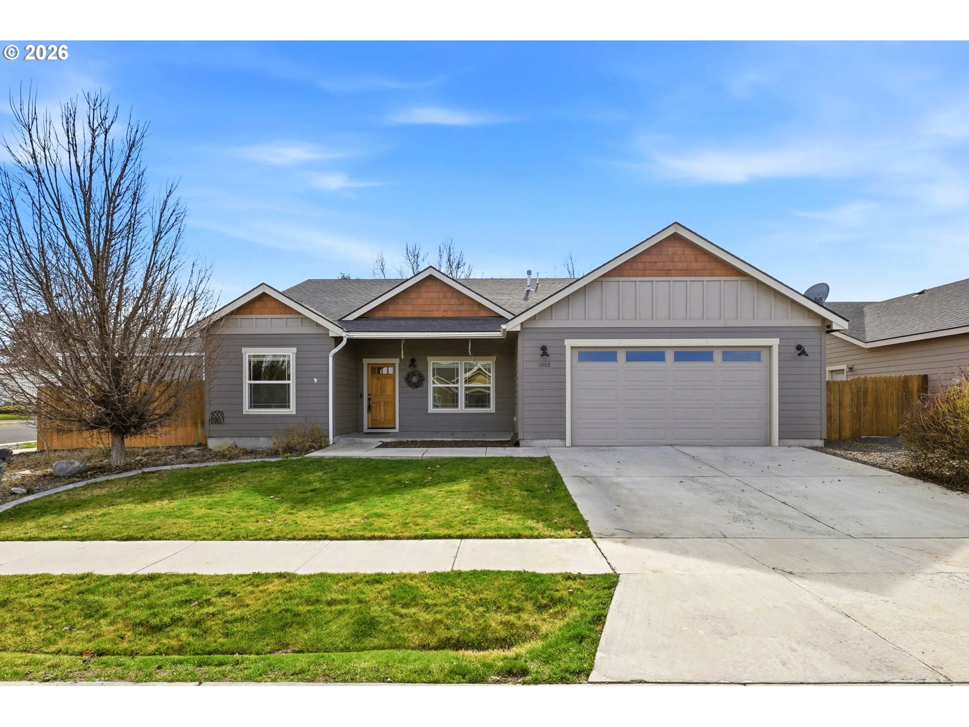 1003 Southwest Olive Court Hermiston, OR 97838 - Photo 1 of 34 a front view of a house with a yard