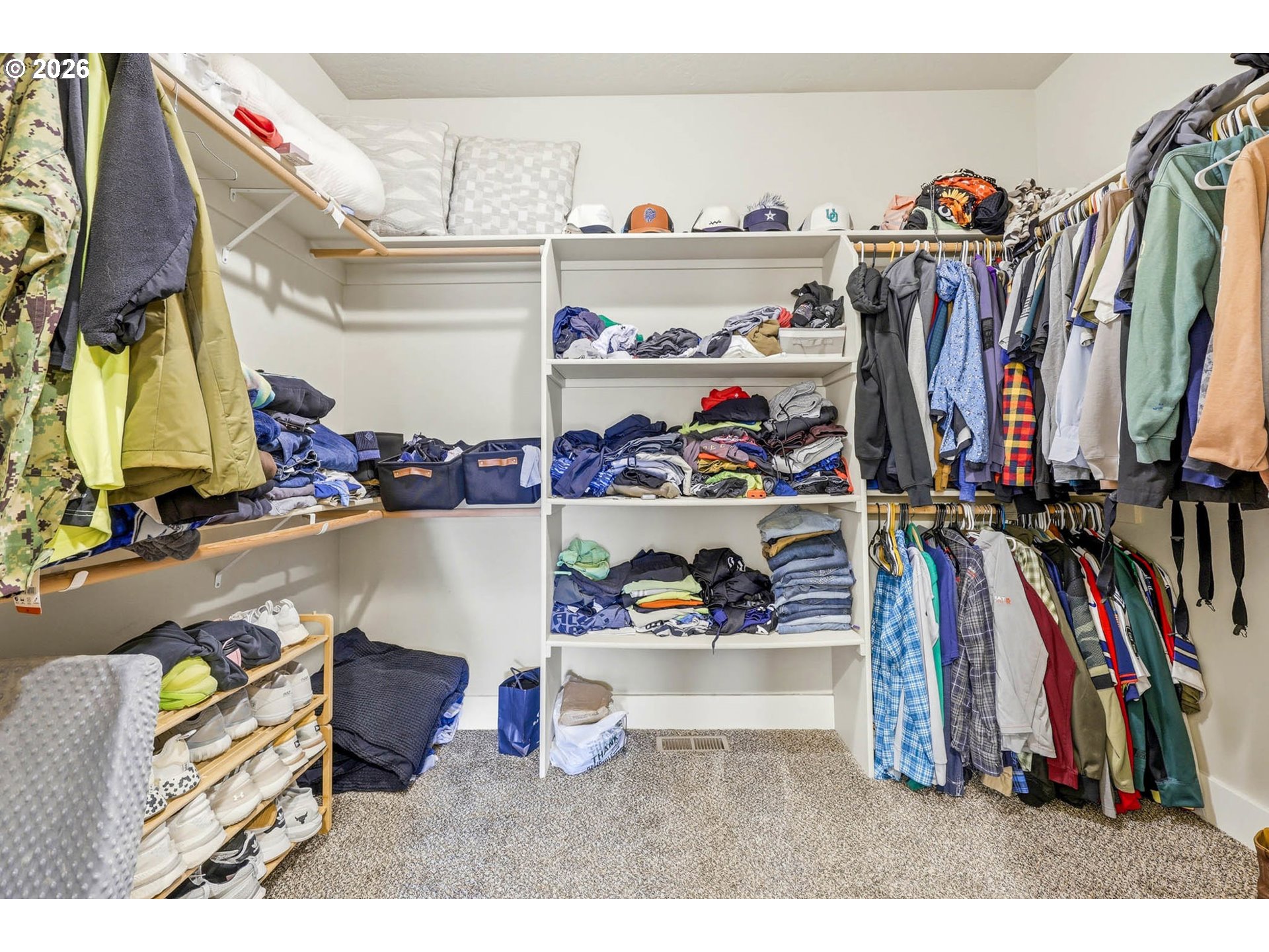 1003 Southwest Olive Court Hermiston, OR 97838 - Photo 16 of 34 a view of walk in closet with clothes and shoes