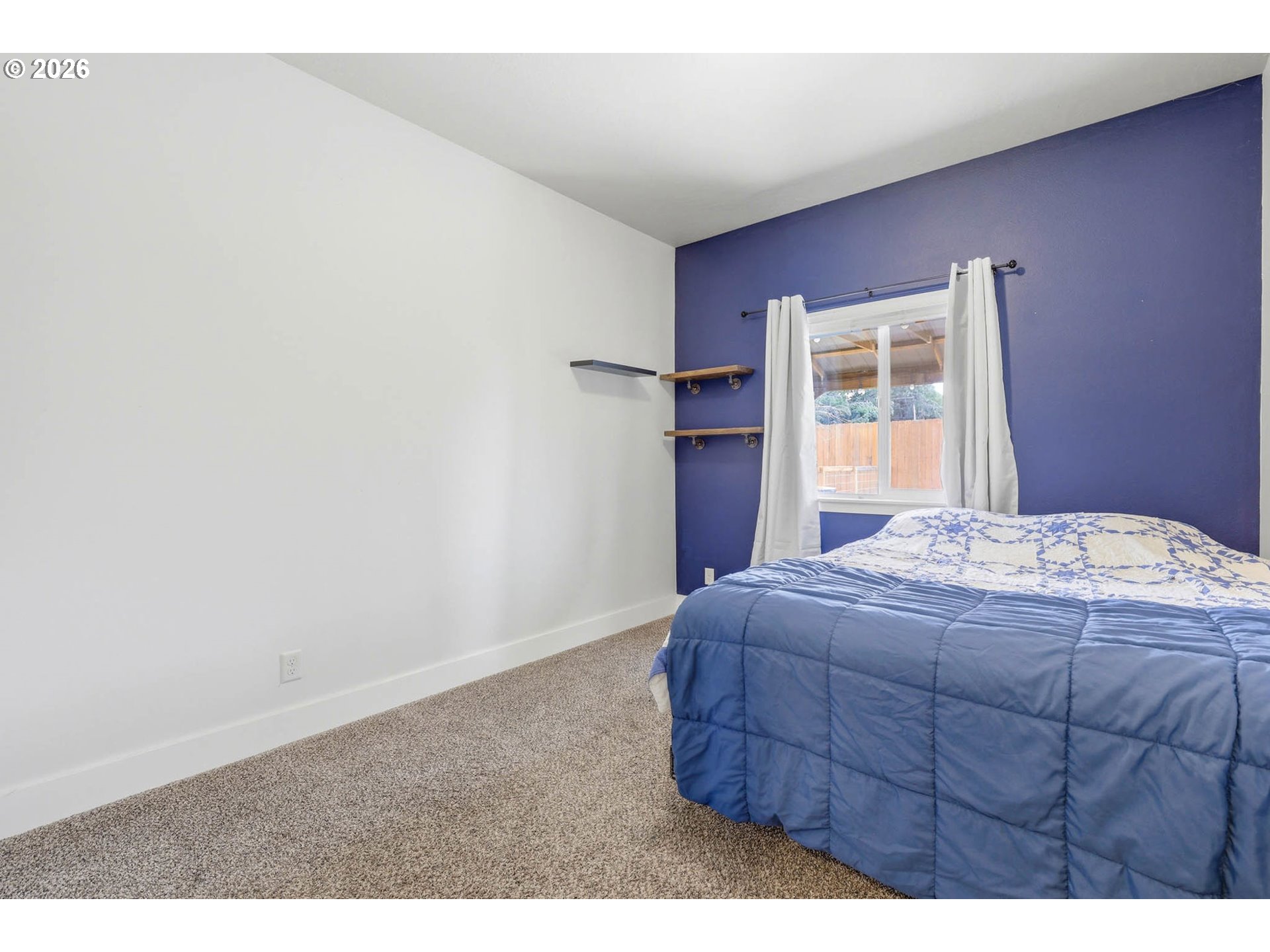 1003 Southwest Olive Court Hermiston, OR 97838 - Photo 19 of 34 a bedroom with a bed and a window