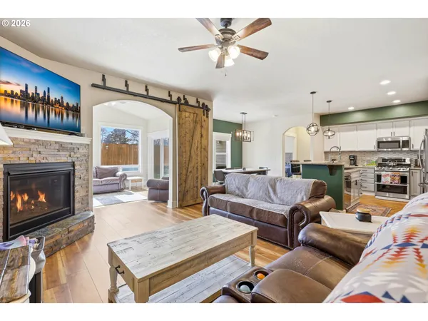a living room with furniture and a fireplace
