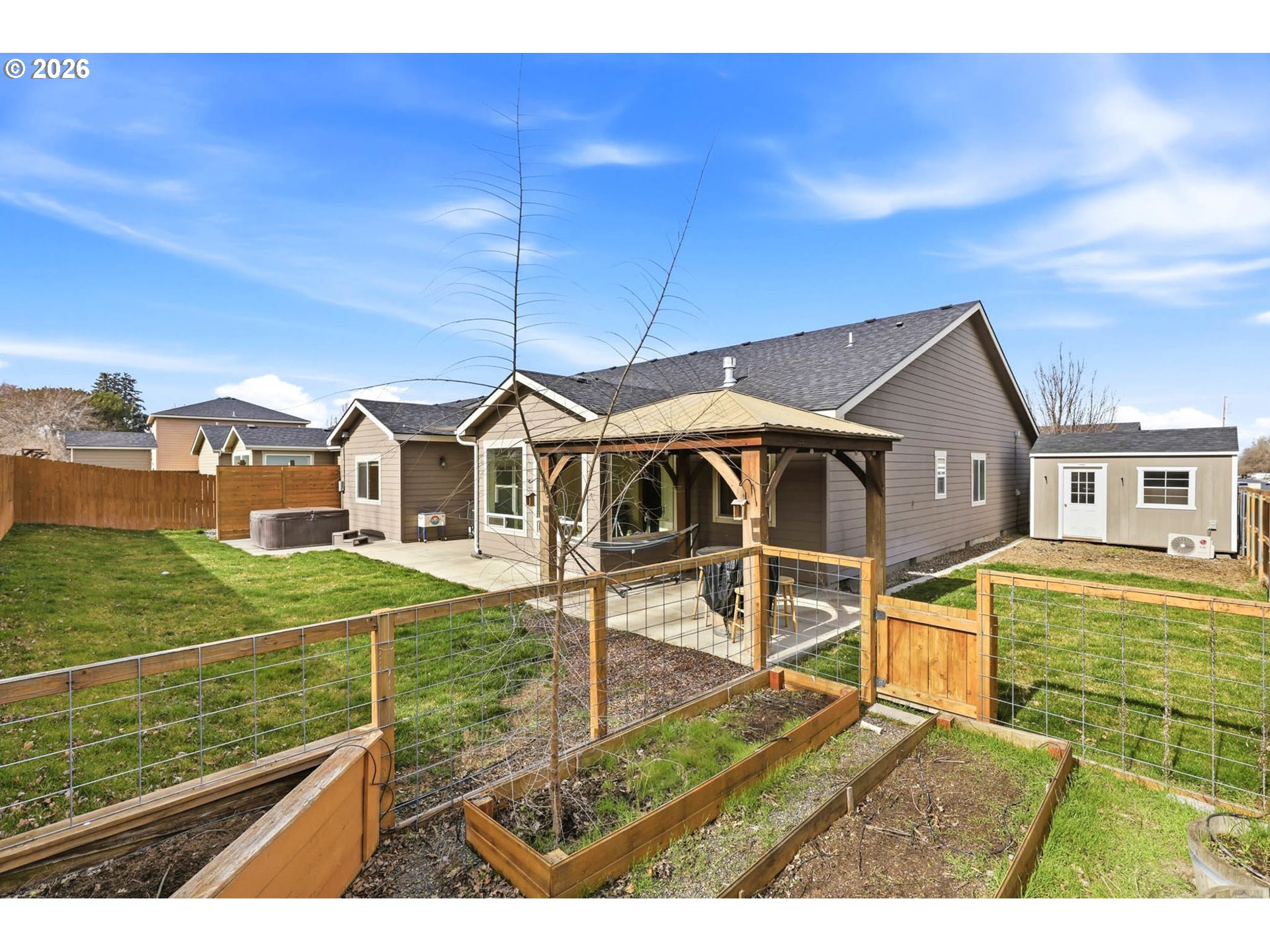 1003 Southwest Olive Court Hermiston, OR 97838 - Photo 25 of 34 a view of a house with a yard