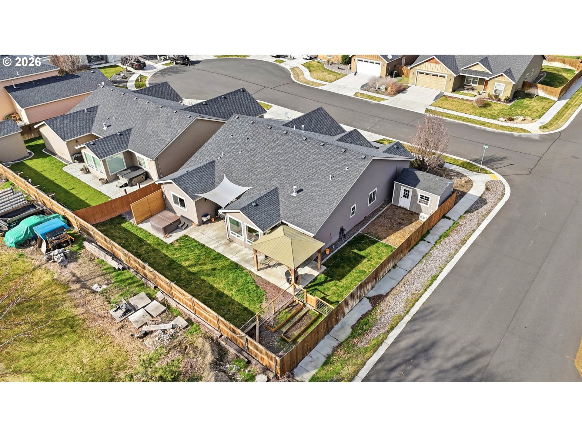1003 Southwest Olive Court Hermiston, OR 97838 - Photo 32 of 34 an aerial view of a house with a garden