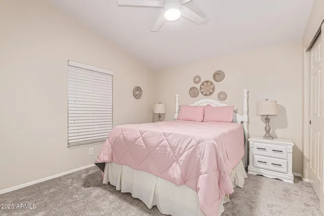 a bedroom with a bed and a chair