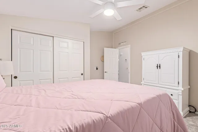 a large white bed in a white room