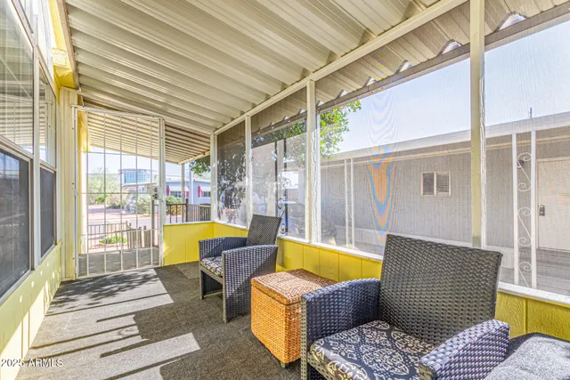 a view of a patio with couches and pool
